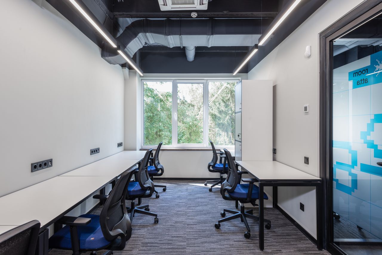 Mastering the First Impression: Your intriguing post title goes here Contemporary open space office with white tables and armchairs placed near glass door and big window in creative business center